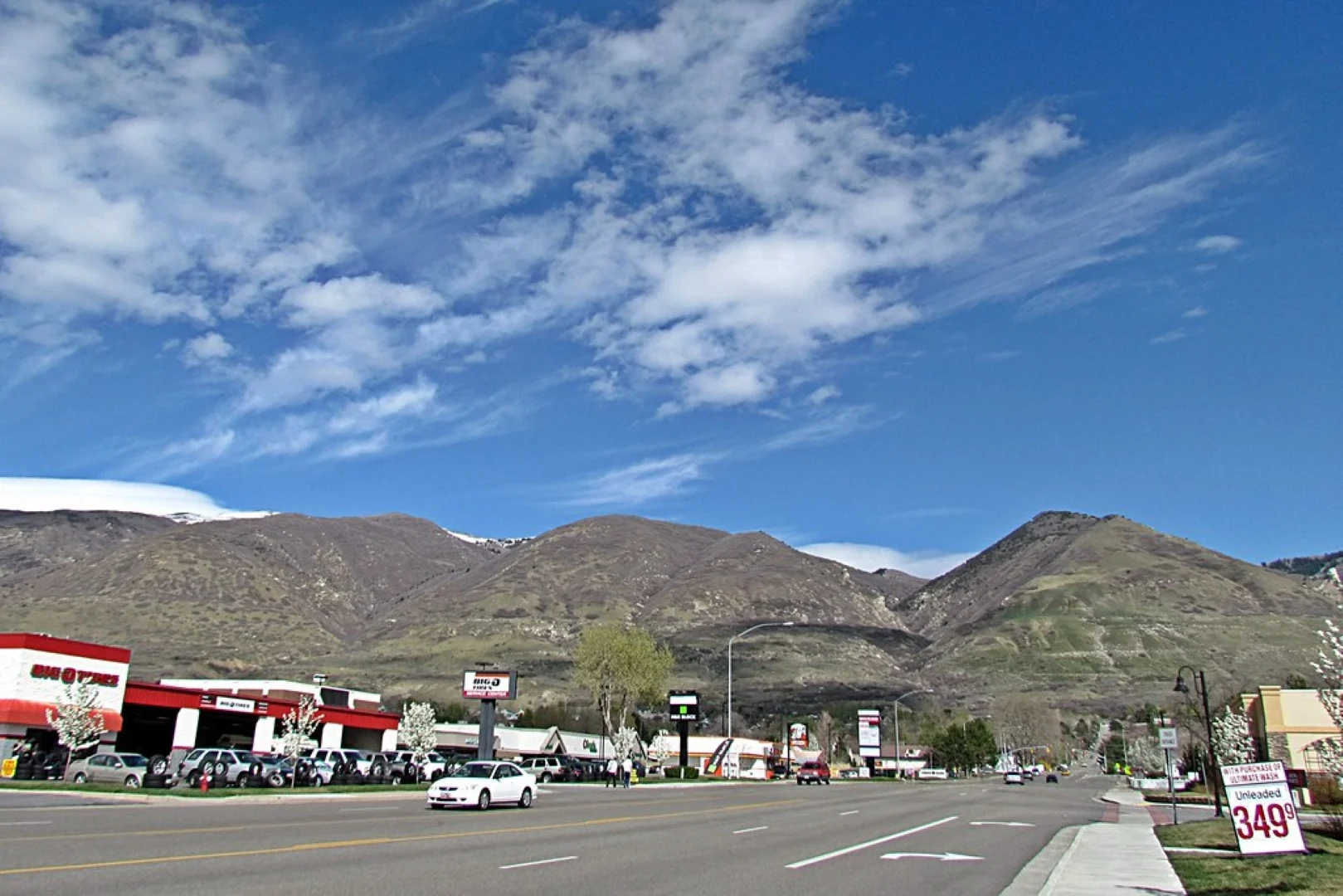 Big O Tires store with mountains in the background.