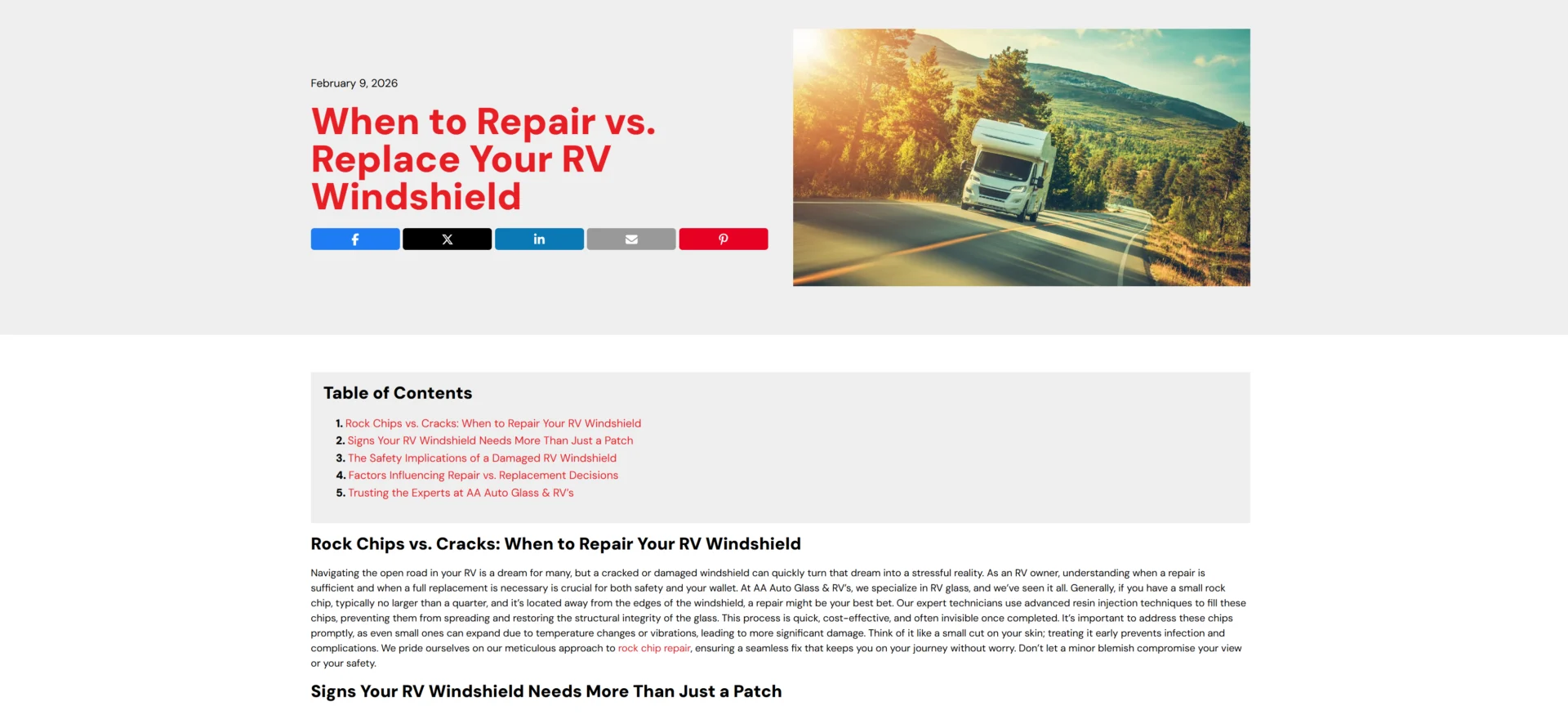 RV on a winding road with a damaged windshield